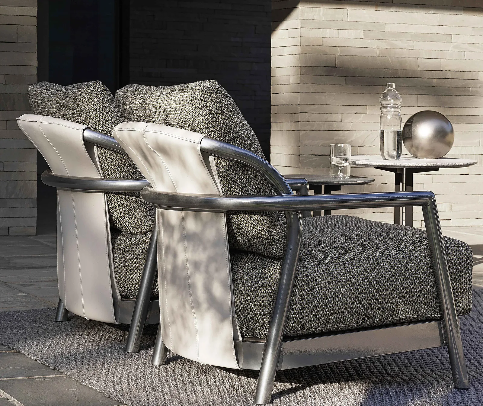 Flexform Alison outdoor armchair in a garden setting, frame 1