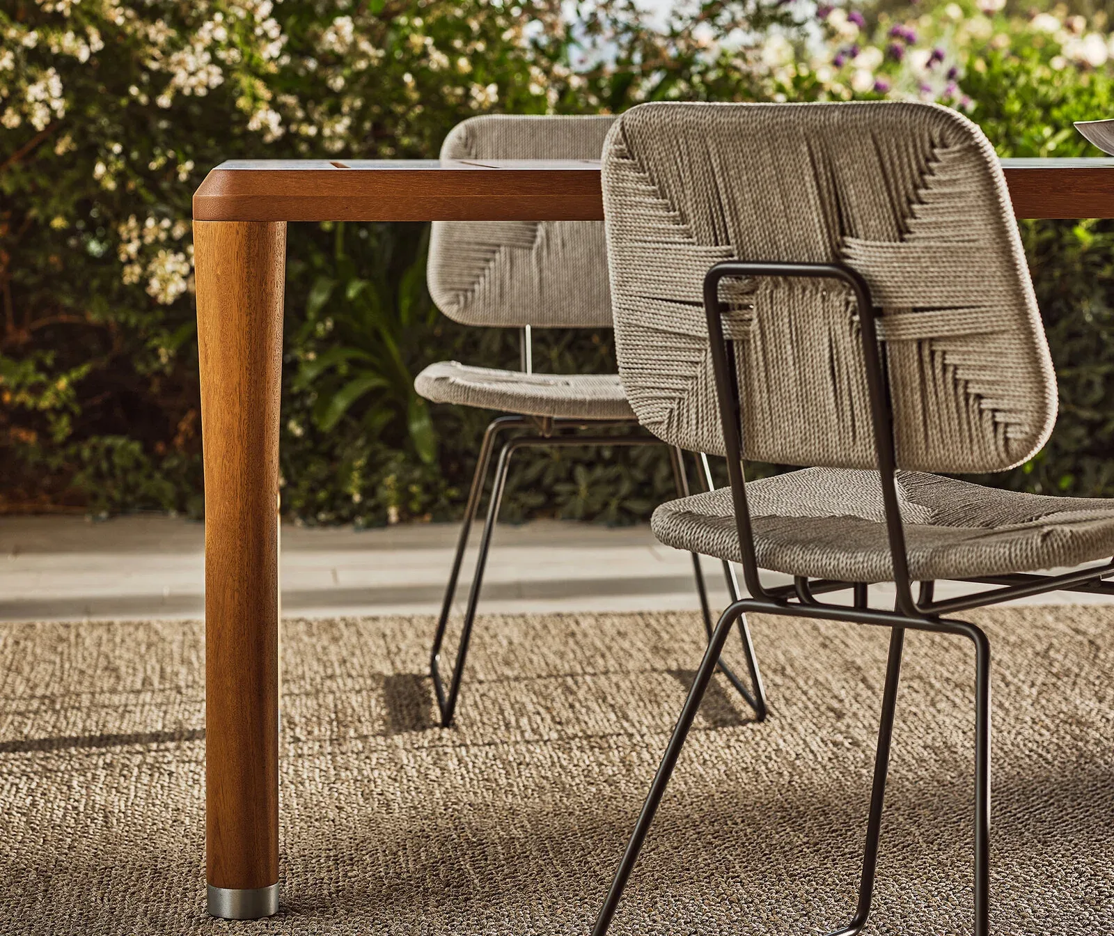 Flexform Echoes outdoor chair in a garden setting, frame 3