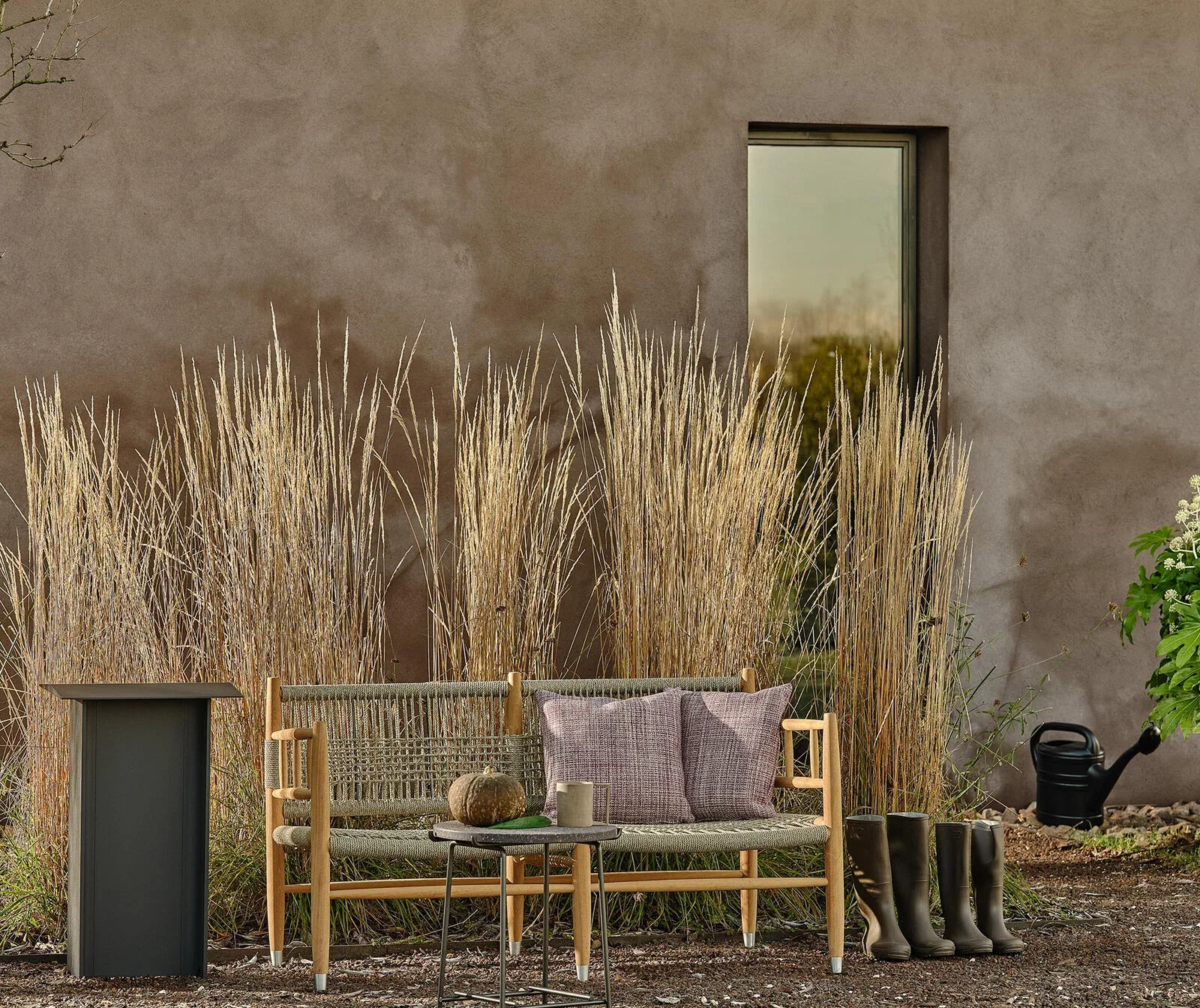 Flexform Lee outdoor sofa in a garden setting, frame 2