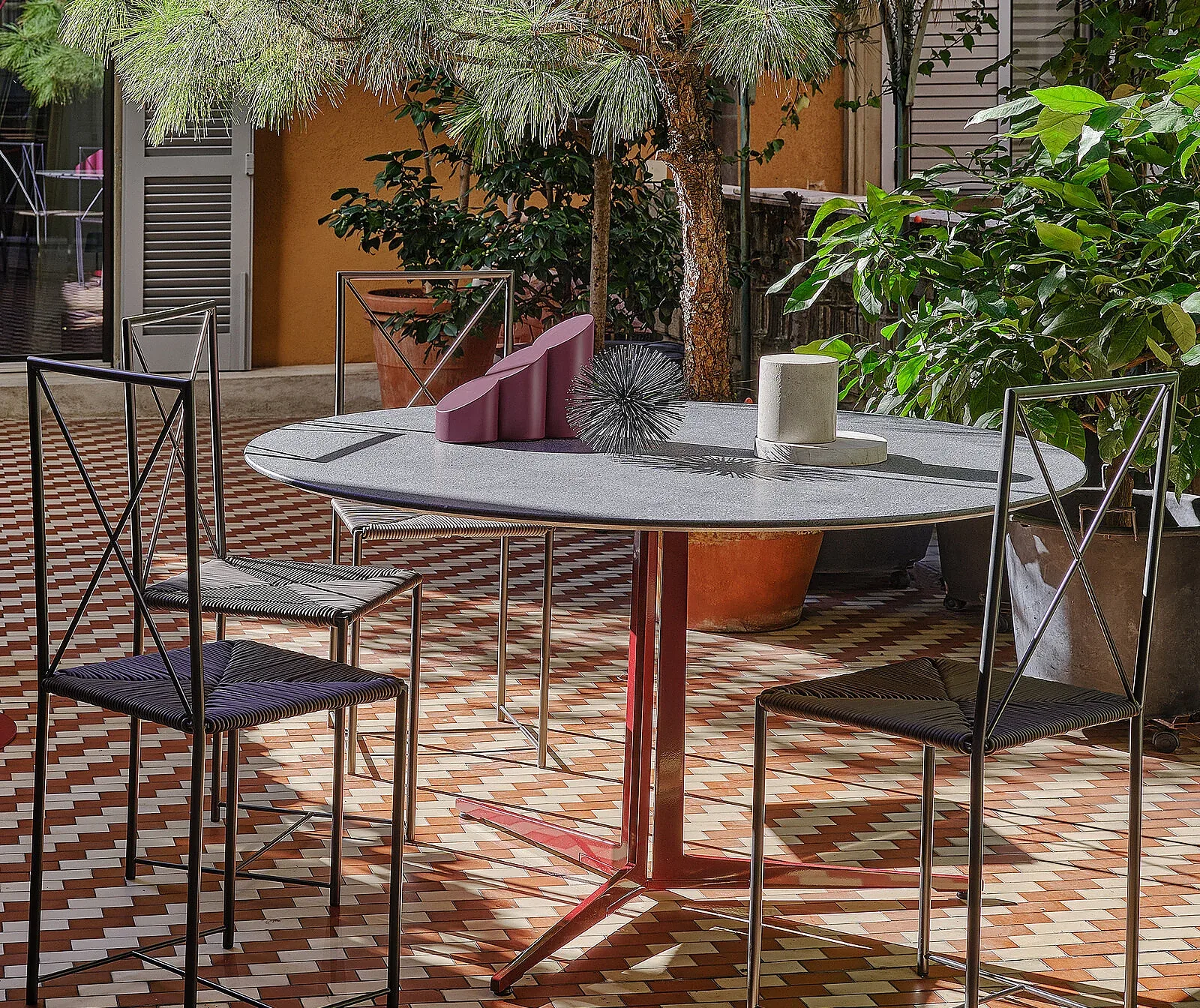 Flexform Moka outdoor chair in a garden setting, frame 2
