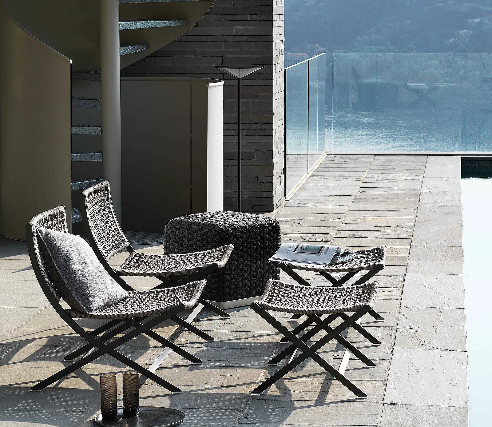 Flexform Peter outdoor armchair in a garden setting, frame 1