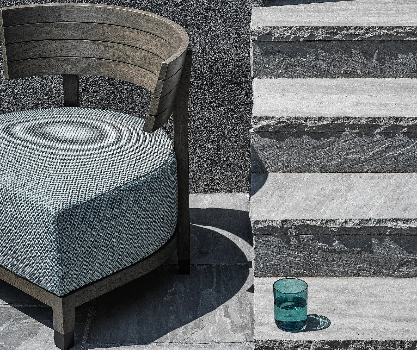 Flexform Thomas outdoor armchair in a garden setting, frame 2
